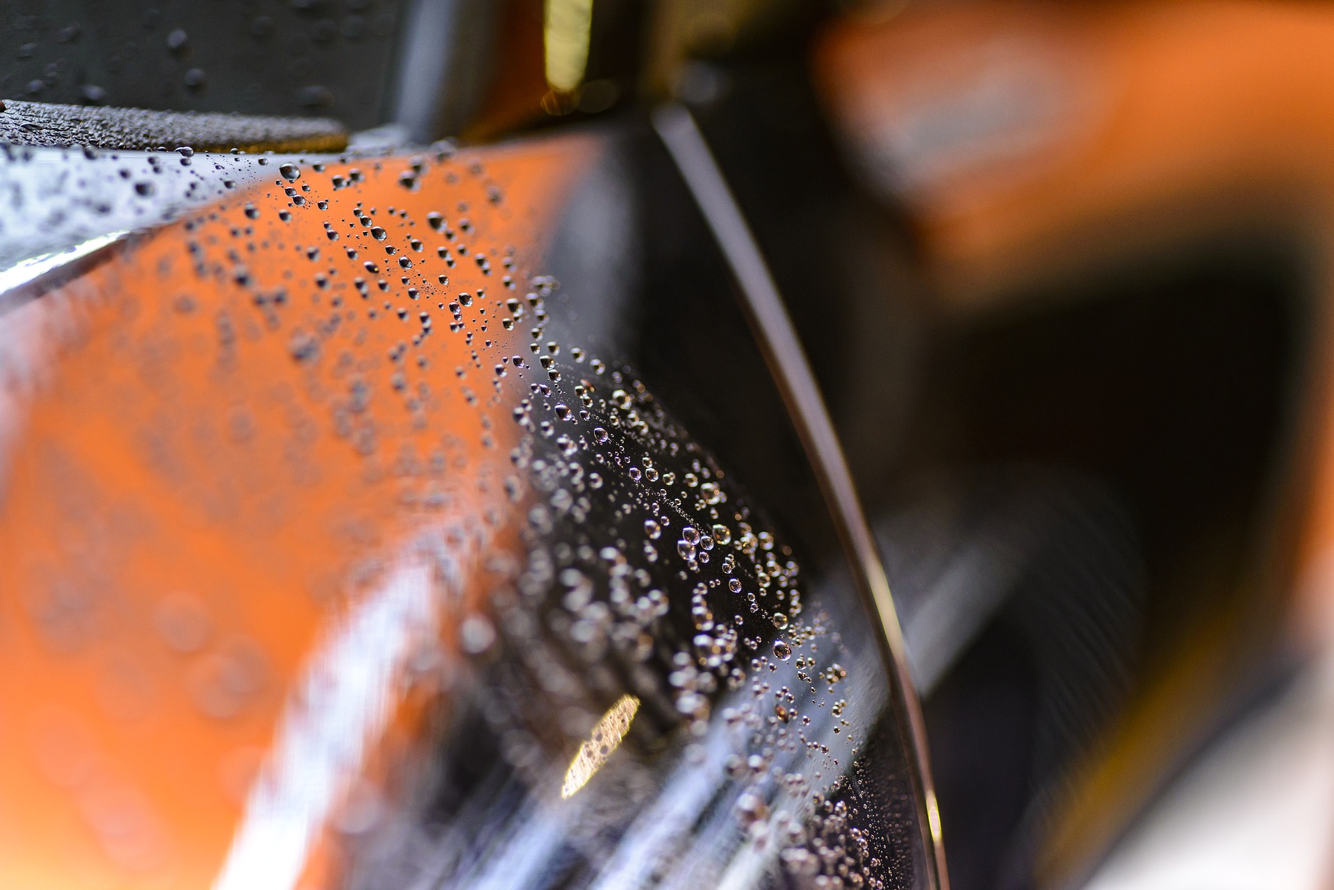 Water beads on a black car Decatur Autowash best wash